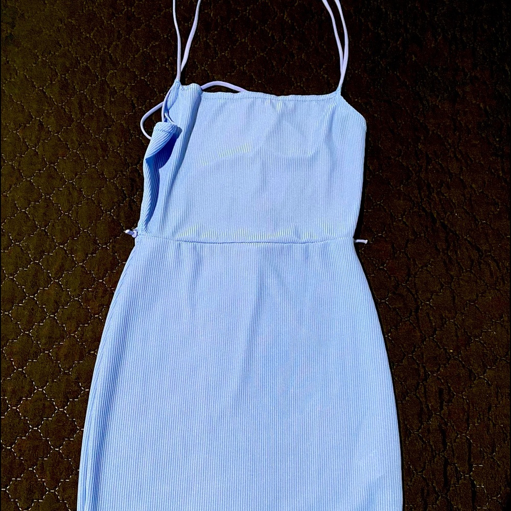 Baby blue strappy dress.